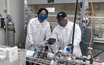 NCCU physics students Nicholas Edwards and Samuel Candelario Torres grow two-dimensional materials using a chemical vapor deposition system.